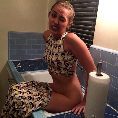 Miley Cyrus Pinching A Loaf In A Kitchen Sink